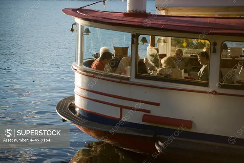 Guests in a ship restaurant on Alster, People sitting in a restaurant, a discarded Alster-steamer at Alster, Hamburg, Germany