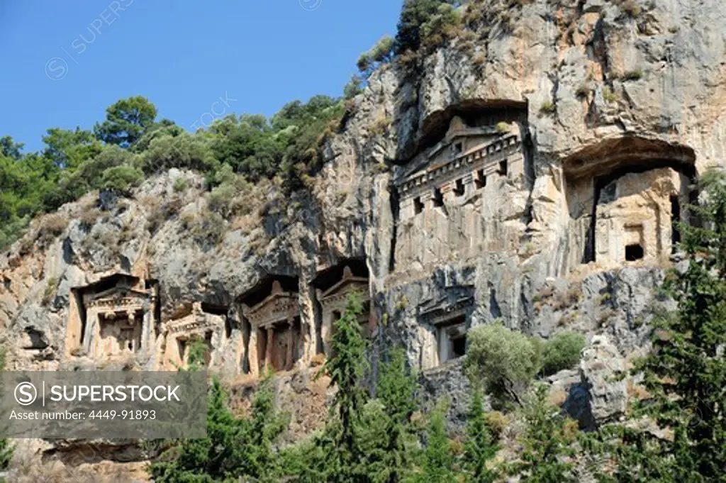 Lycian burial place in the rocks, tombs facing the river delta at Caunos, Dalyan in the district of Mugla, Mediterranean, Turkey