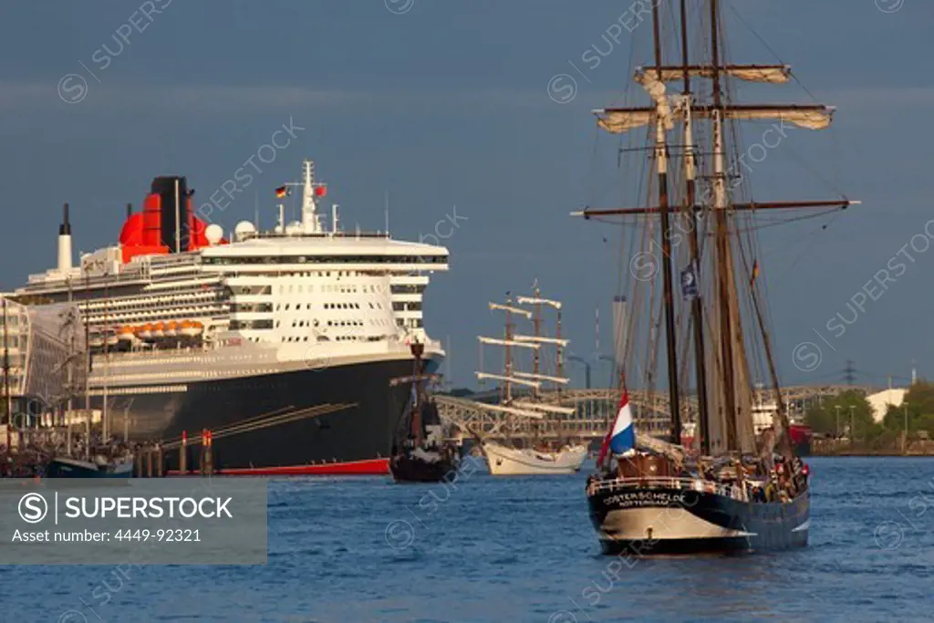 Sailing ship in front of cruise ship Queen Mary 2 at harbour, Hamburg Cruise Center Hafen City, Hamburg, Germany, Europe