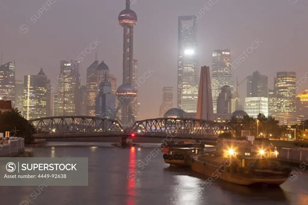 View of Huangpu River with Waibaidu bridge and Pudong skyline at night, Shanghai, China, Asia
