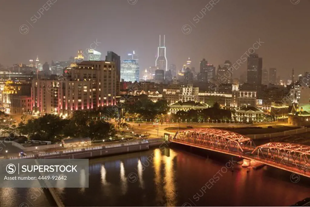 View of Waibaidu bridge and illuminated houses at night, Bund, Shanghai, China, Asia