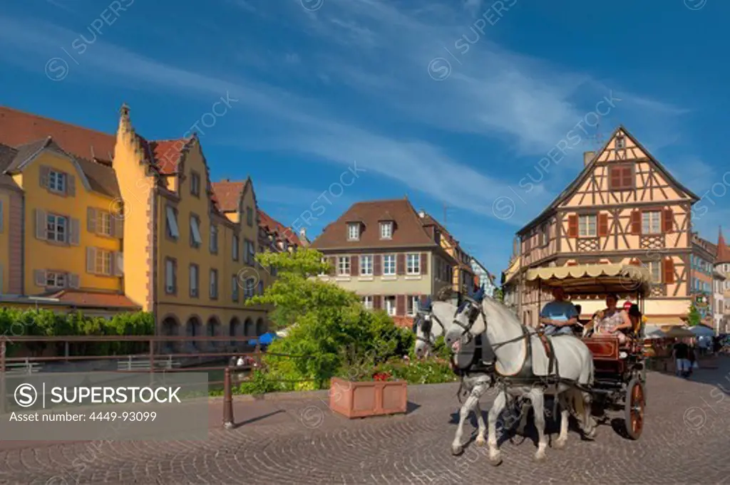 Horse drawn carriage in front of half timbered houses, Little Venice, Colmar, Alsace, France, Europe