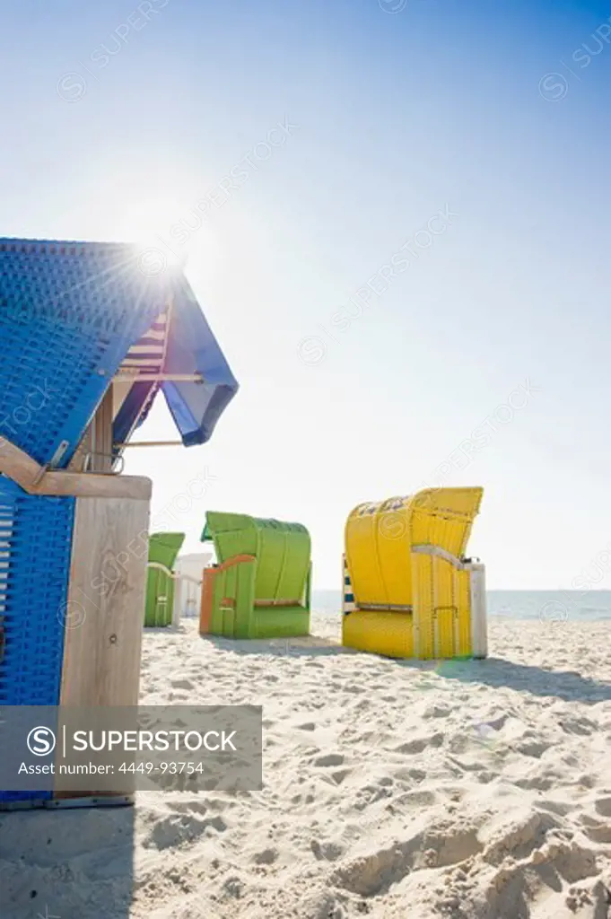 Colourful beachchairs on the beach in the sunlight, Wyk, Foehr, North Frisian Islands, Schleswig-Holstein, Germany, Europe