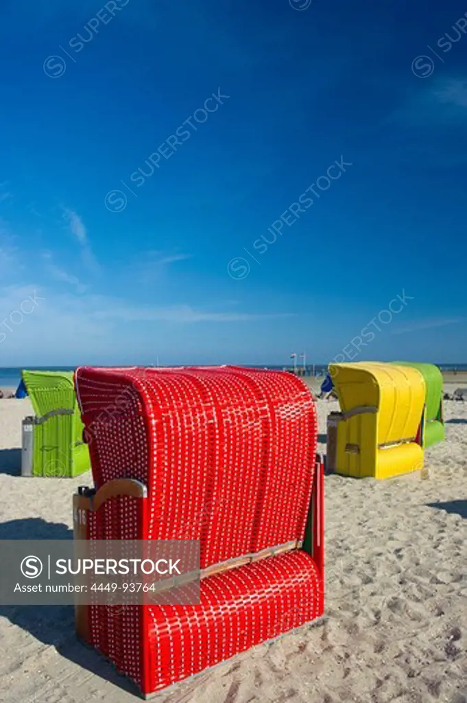 Colourful beachchairs under blue sky, Utersum, Foehr, North Frisian Islands, Schleswig-Holstein, Germany, Europe