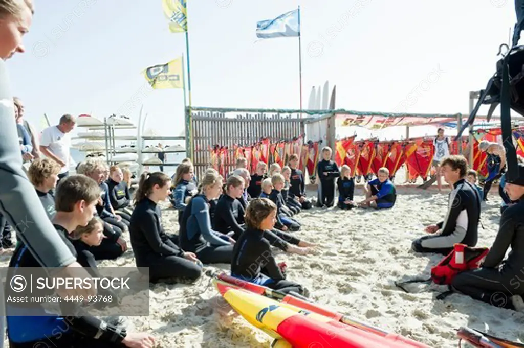 Children at a sailboarding school on the beach, Wyk, Foehr, North Frisian Islands, Schleswig-Holstein, Germany, Europe