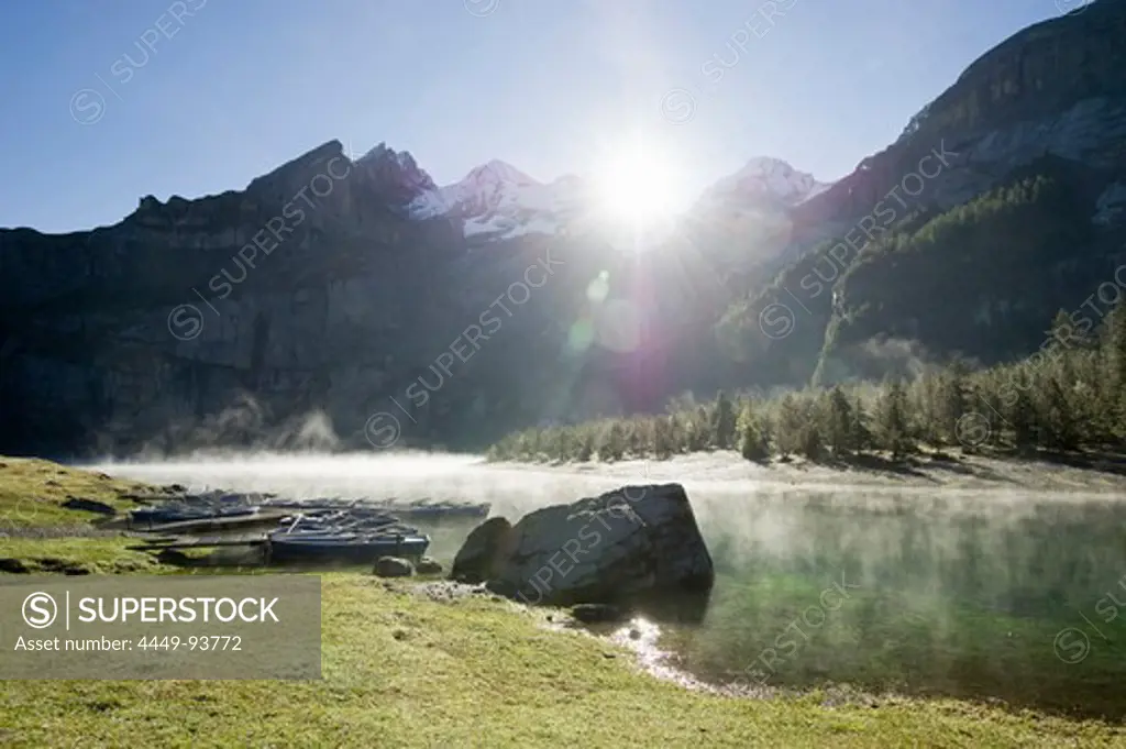Sunrise and morning mist at lake Oeschinensee, Kandersteg, Bernese Oberland, Canton of Bern, Switzerland, Europe