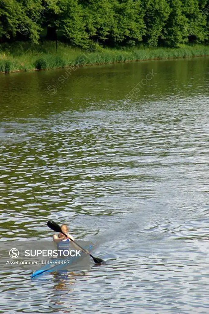 Canoeist in  Elster Floodchannel, Clara Zetkin Parc, Saxony, Germany