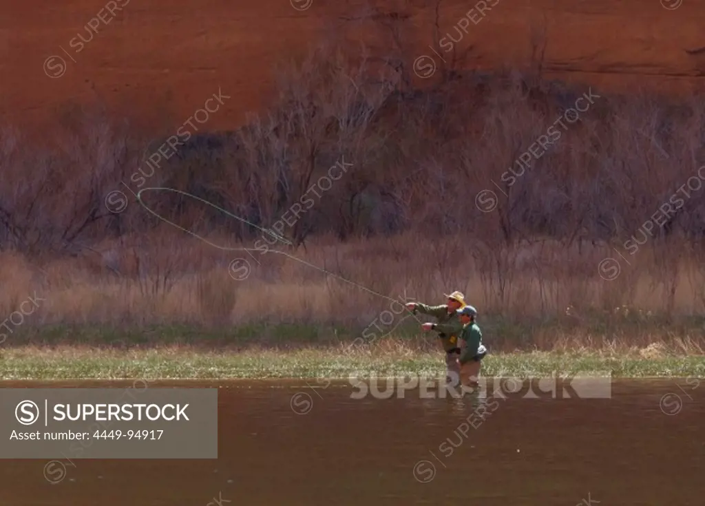 Anglers standing in the Colorado river, between Glen Canyon Dam and Lees Ferry, Glen Canyon, Arizona, USA, America