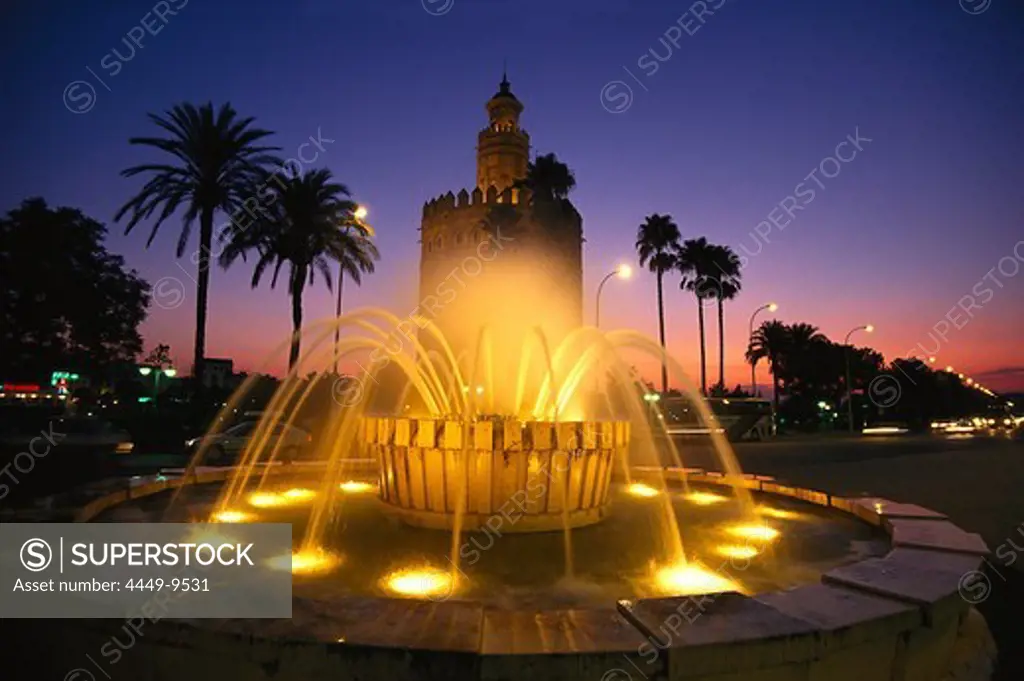 Torre del Oro at night, Gold tower, a military watchtower, Paeso de Christobal, Colon, Seville, Andalusia, Spain