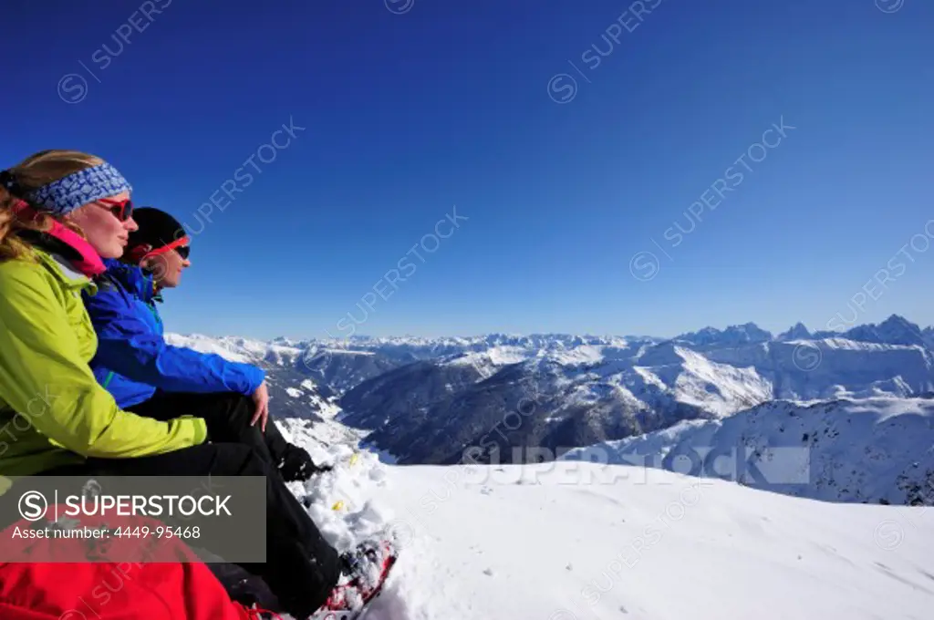 Young woman and young man resting at mount Kreuzspitze, East Tyrol, Tyrol, Austria