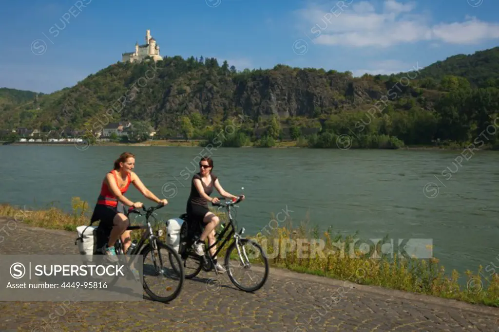 Cyclists at Marksburg castle,  Unesco World Cultural Heritage, near Braubach, Rhine river, Rhineland-Palatinate, Germany