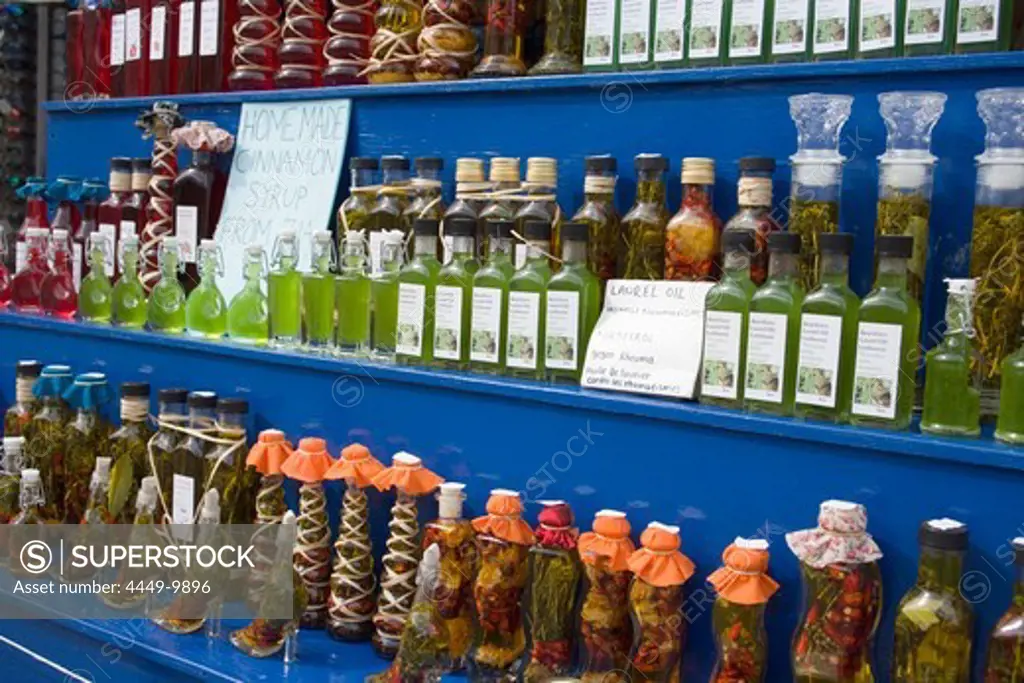 Different bottles with oil and syrup in a souvenir shop, Zia, Kos, Greece