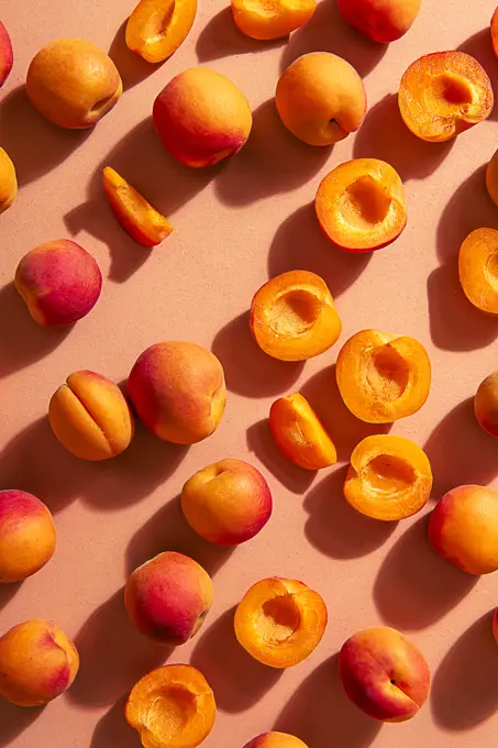 Scattered apricots, whole and halved