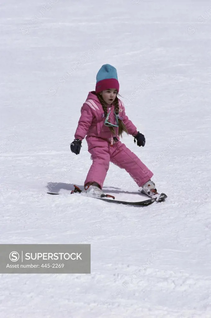 Young girl skiing on snow