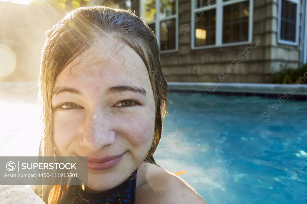 Portrait of a teenage girl in a swimming pool, head and shoulders