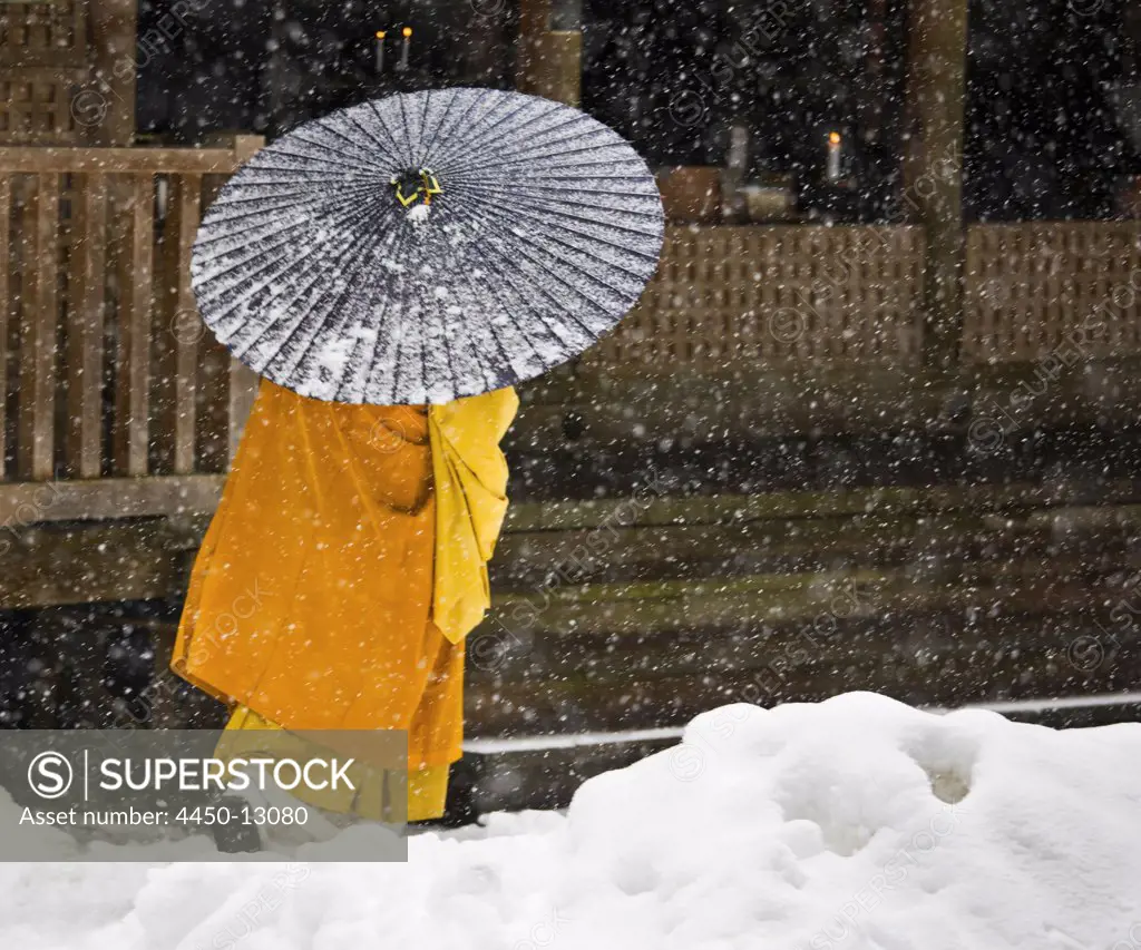 A Bhuddist monk walks through a snow flurry in Koyasan, a centre for Shingon Esoteric Buddhism. November 2, 2008
