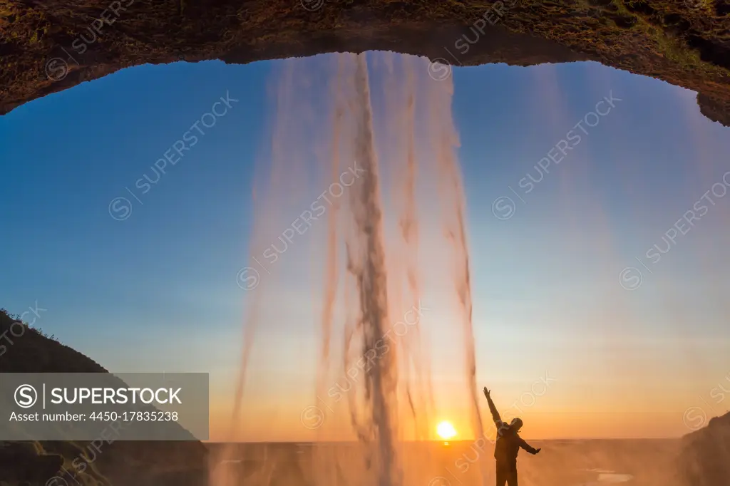 Man behind Seljalandsfoss Waterfall, South Iceland, Iceland