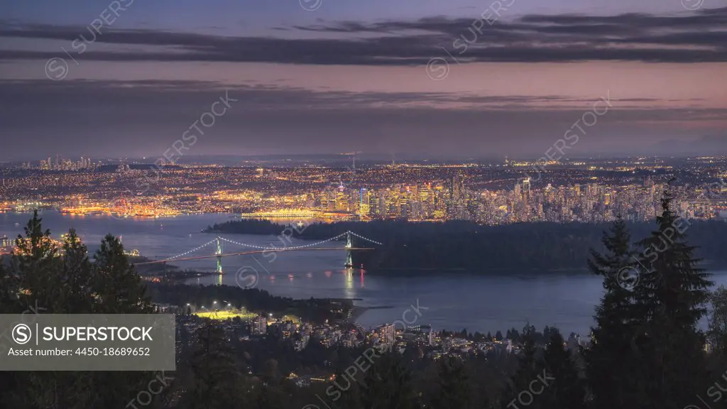 Vancouver city lit up at dawn.