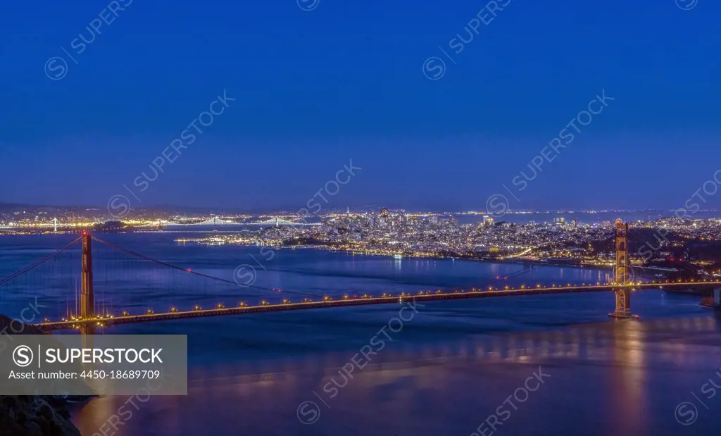 Golden Gate bridge across San Francisco bay at twilight.