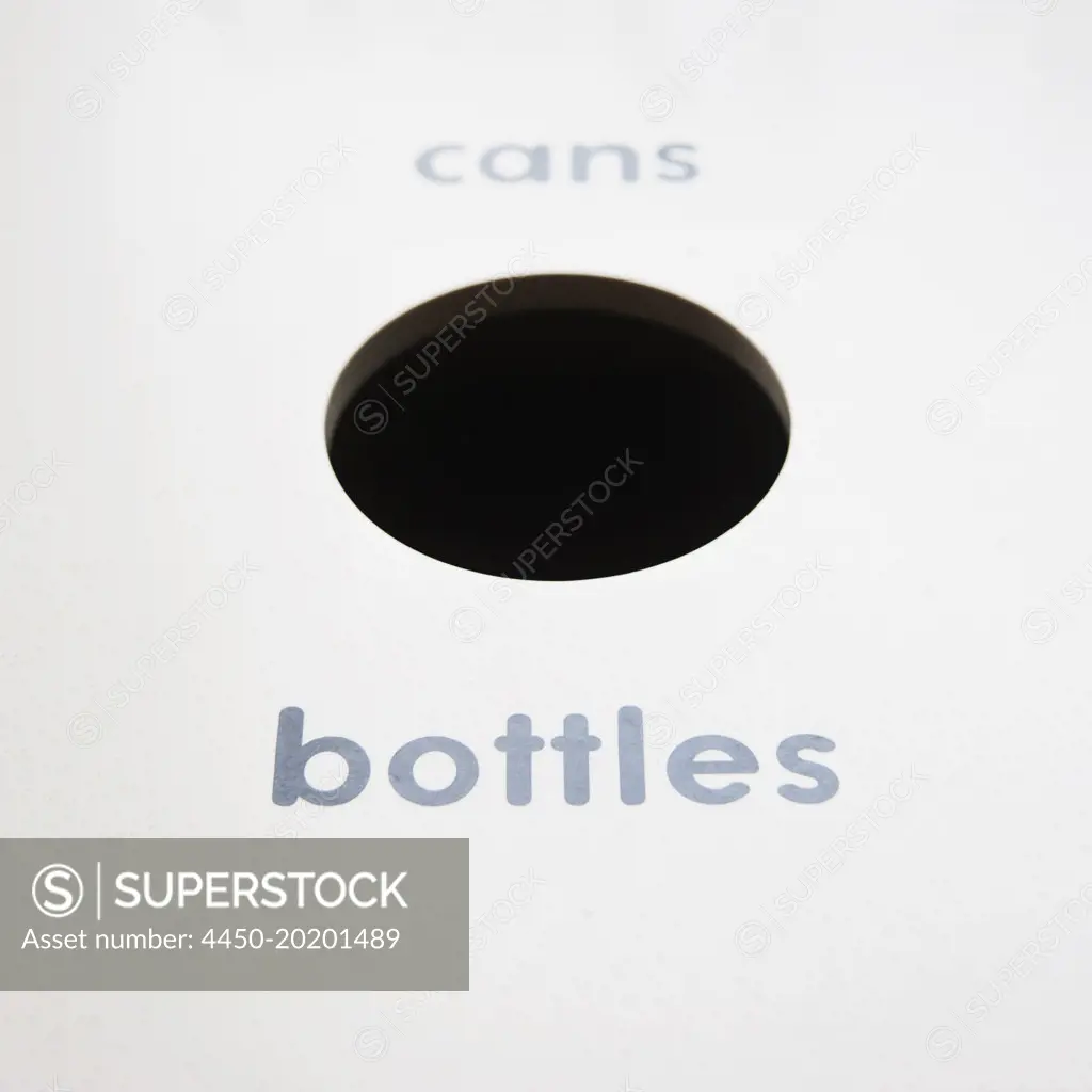 A recycling bin for bottles and cans. 
