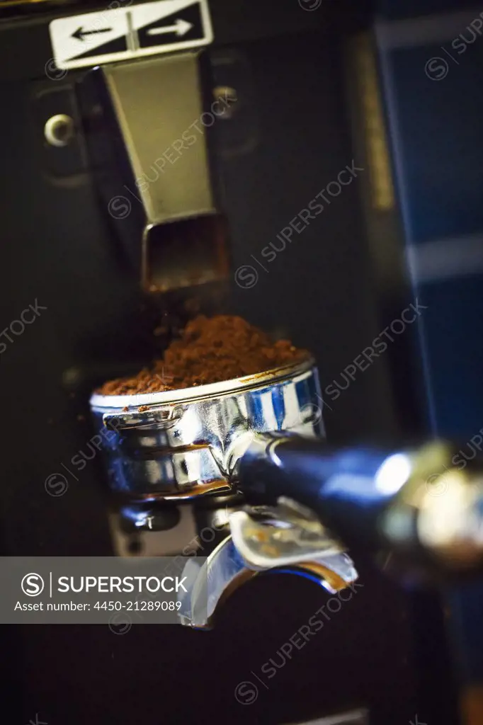 Close up of portafilter of an espresso machine.