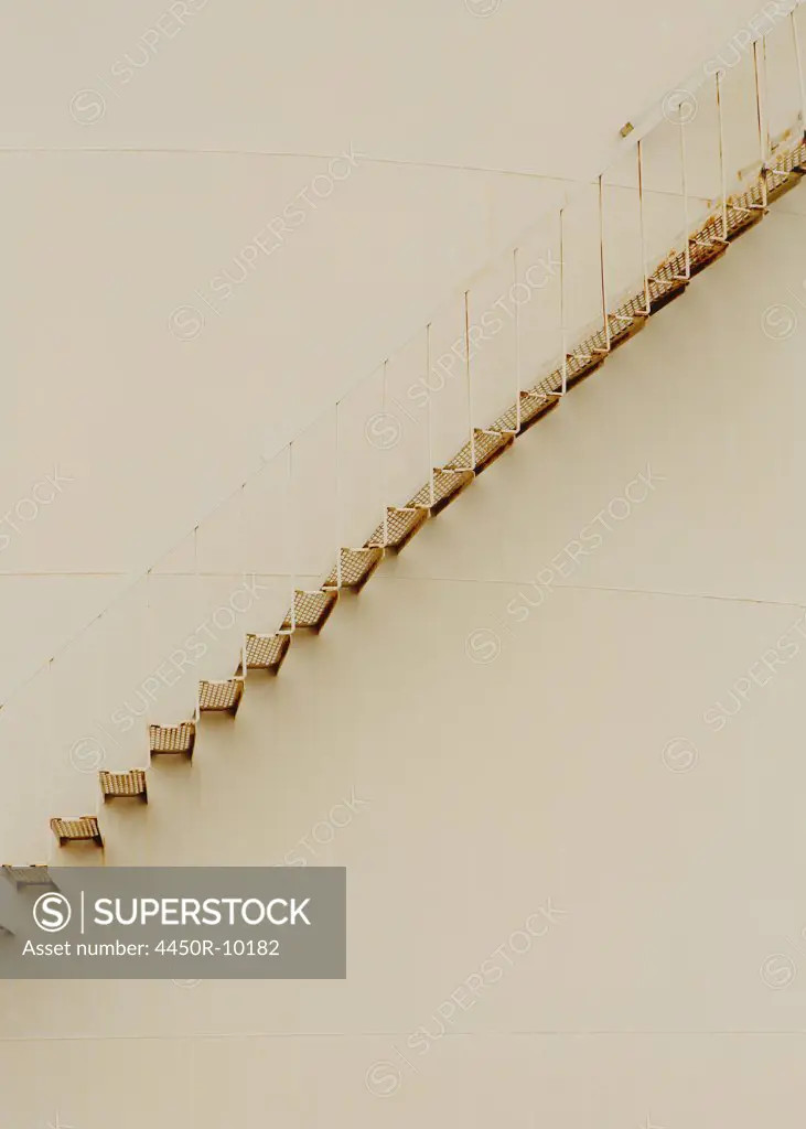 Steps on oil storage containerTaft, Kern County, California, USA