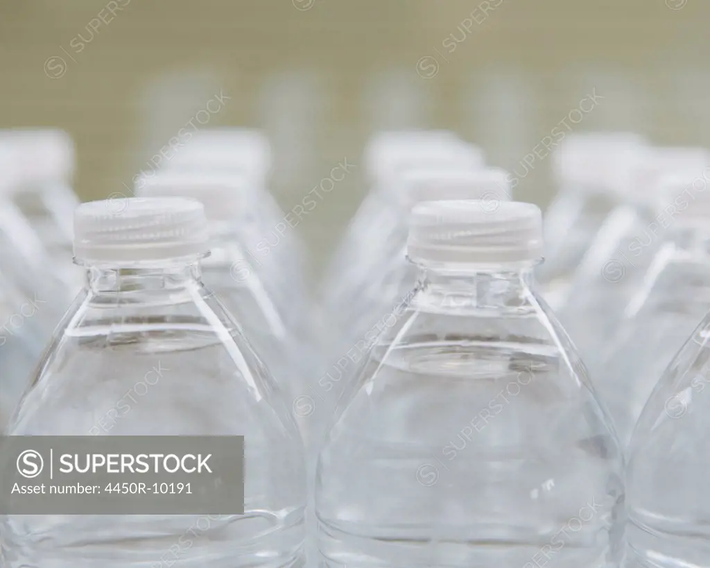 Rows of water-filled plastic bottles with screw caps. King County, Washington, USA