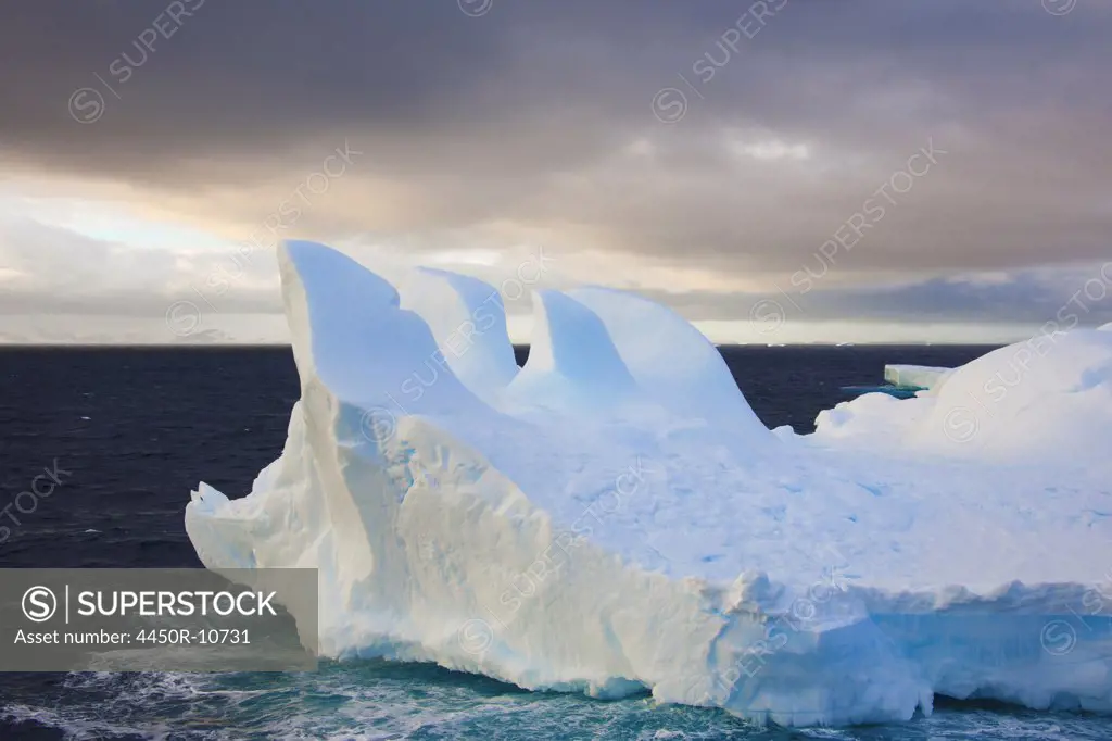 Icebergs floating on the Antarctic southern oceans. Eroded by wind and weather, creating interesting shapes.  Antarctica,