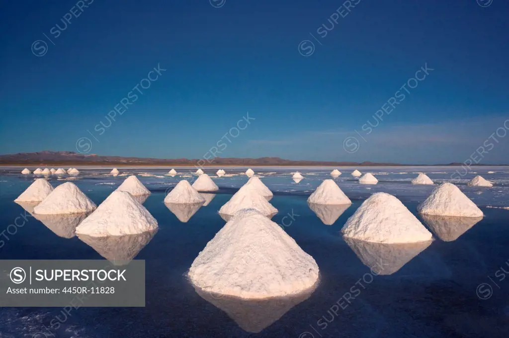 Piles of salt dry in the arid atmosphere of Bolivia's Salar de Uyuni. Salar de Uyuni, Bolivia