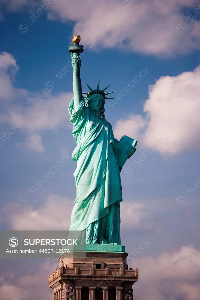 The Statue of Liberty is a national symbol and stands overlooking New York harbour on the Hudson river.  New York City, USA