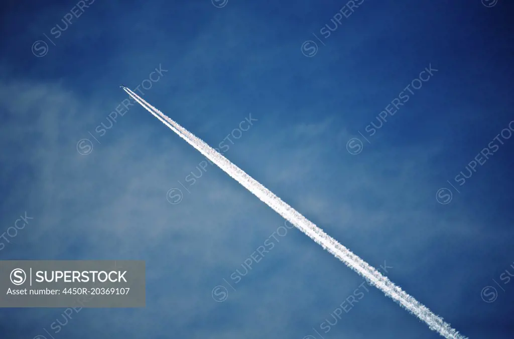 A jet contrail, a vapour trail across the sky.