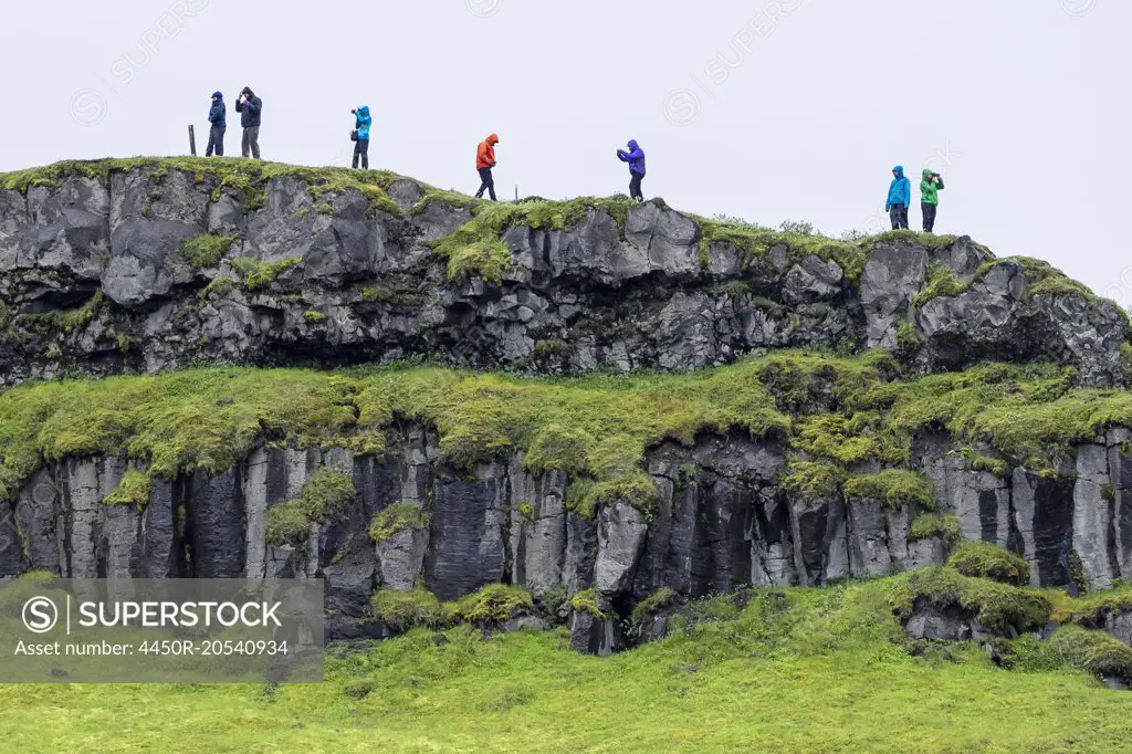 Hikers on the cliffs near Gullfoss