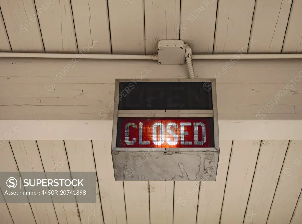 A neon sign saying Closed at a bank in Ellensburg.
