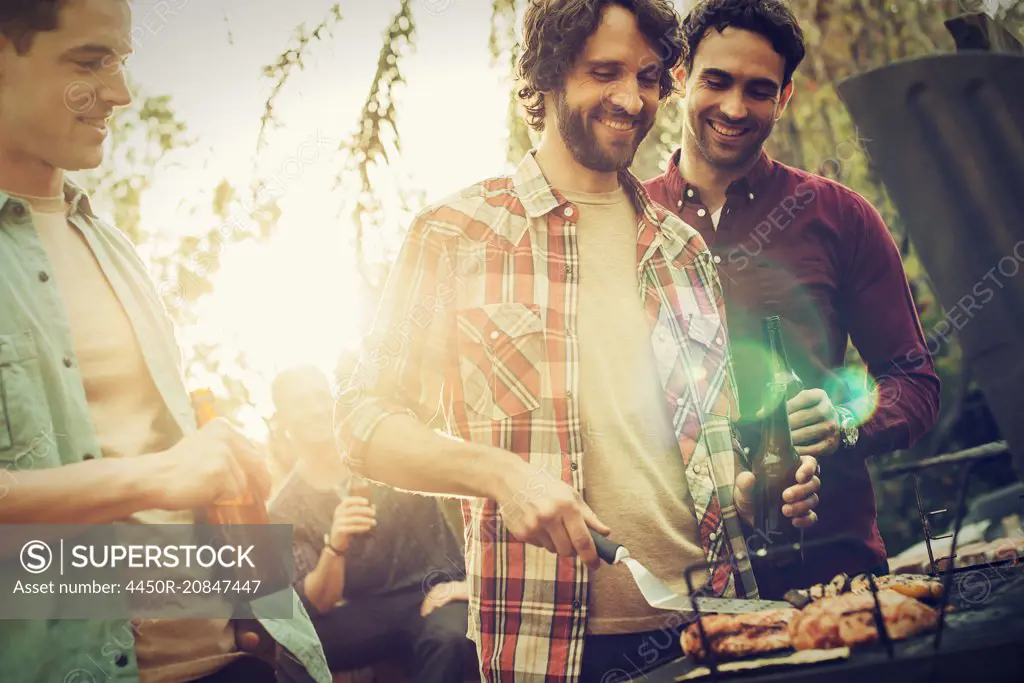 A group of friends at a summer evening barbeque.
