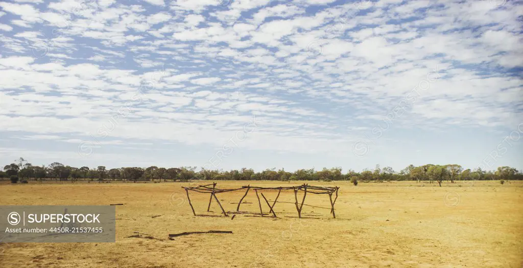 A rural outback landscape and a blue sky.