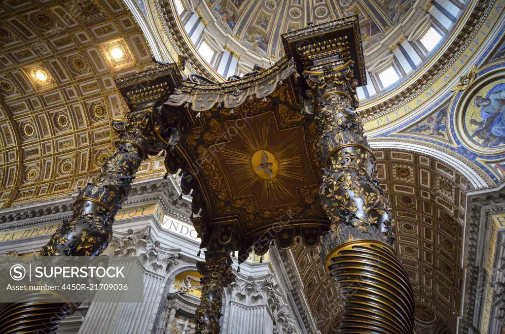 St Peter's Basilica in Rome, Italian Renaissance architecture, and UNESCO world heritage site. Interior views, of the domed ceiling with sacred artwork and frescoes.