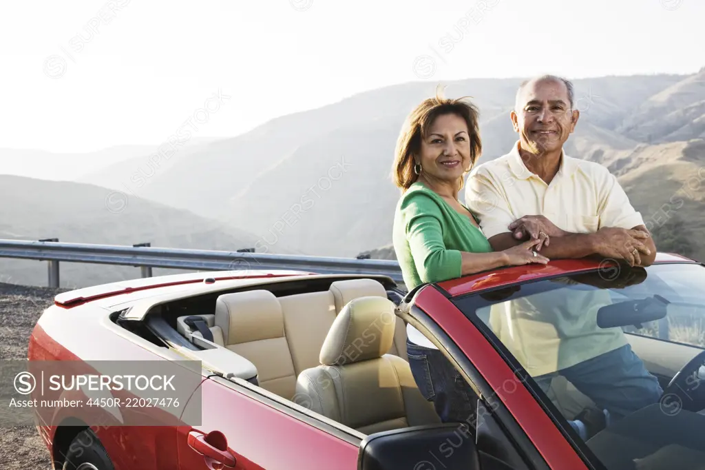 A hip senior Hispanic couple on a road trip in eastern Washington State, USA.