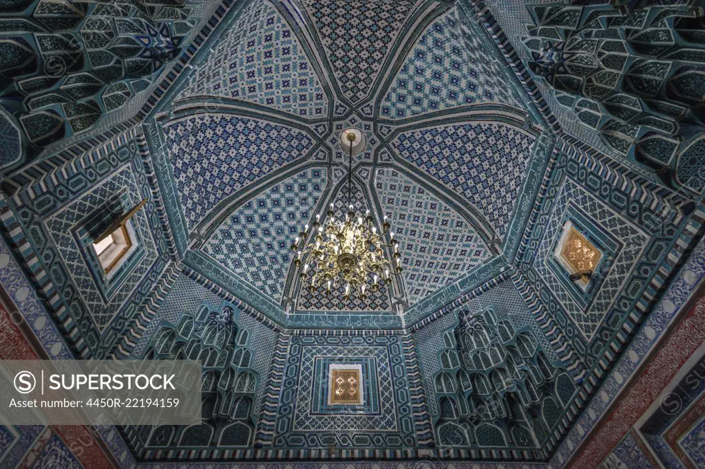 Interior, mosaic patterns in a dome of a Madrasa building in Samarkand.