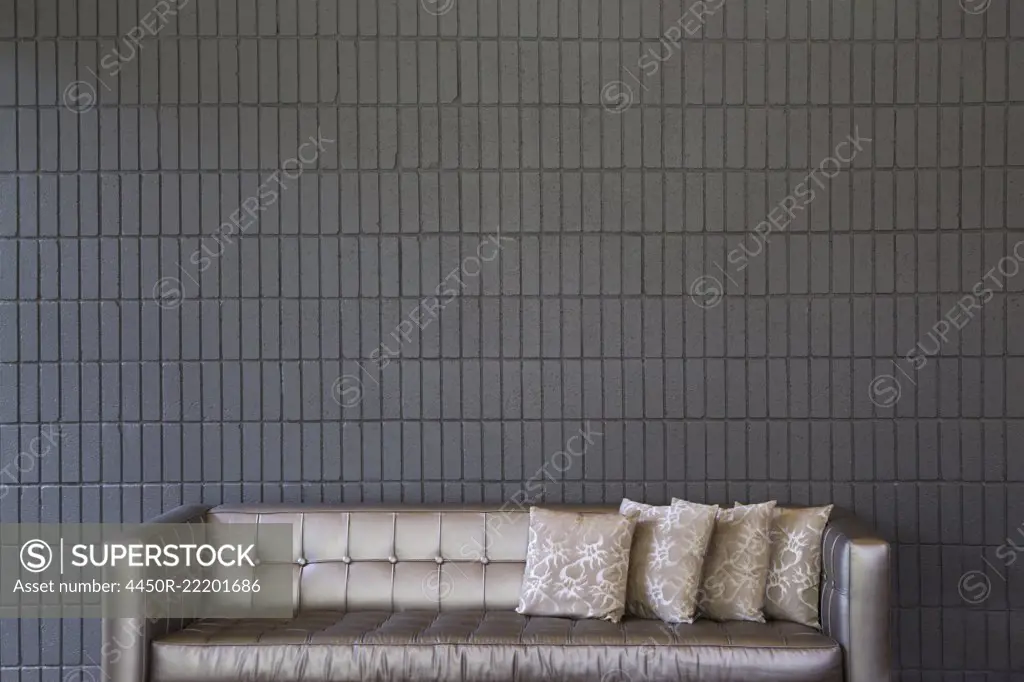 Modern Sofa Against a Brick Wall
