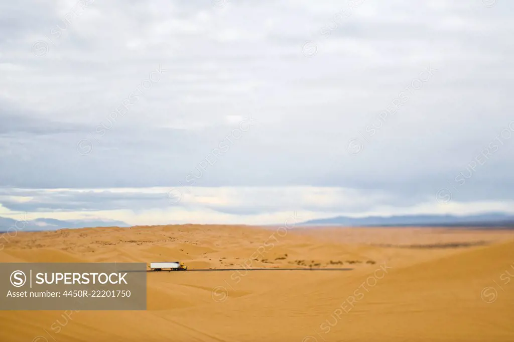 Truck Driving Through Desert
