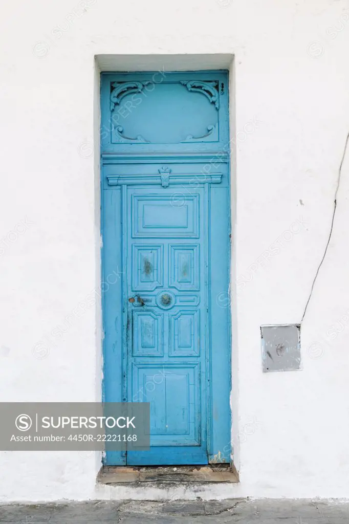 Old Blue Door on White Wall