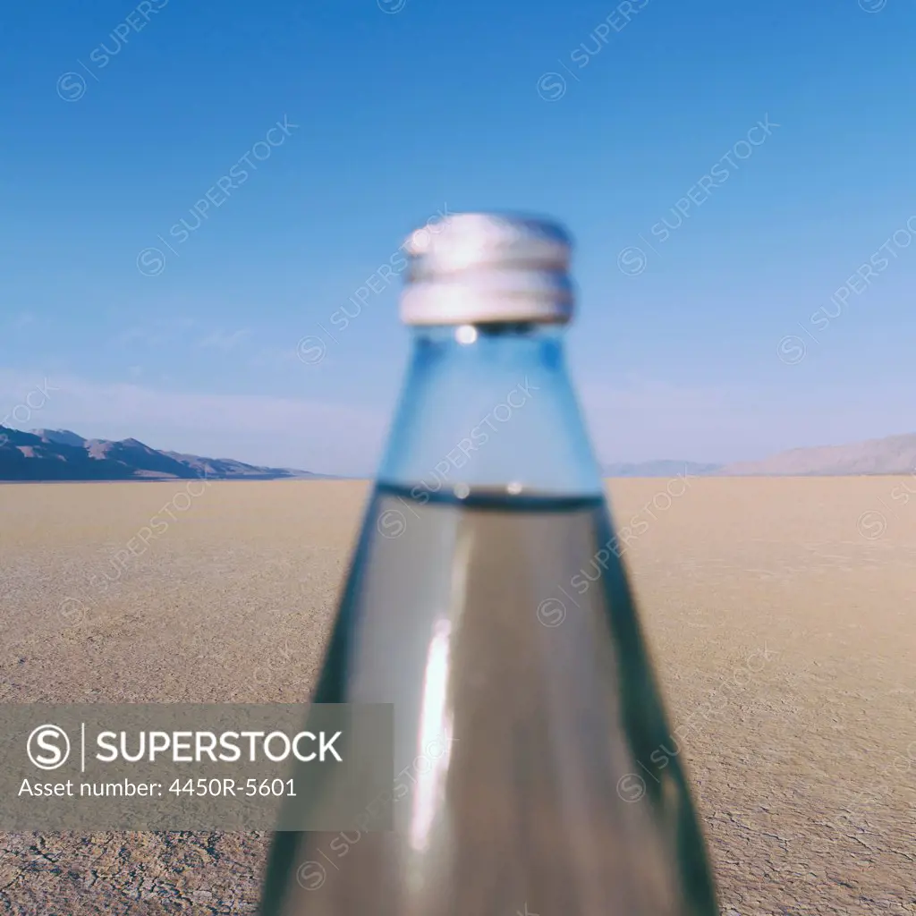 The landscape of the Black Rock Desert in Nevada. An essential element for survival. A bottle of water. Filtered mineral water.