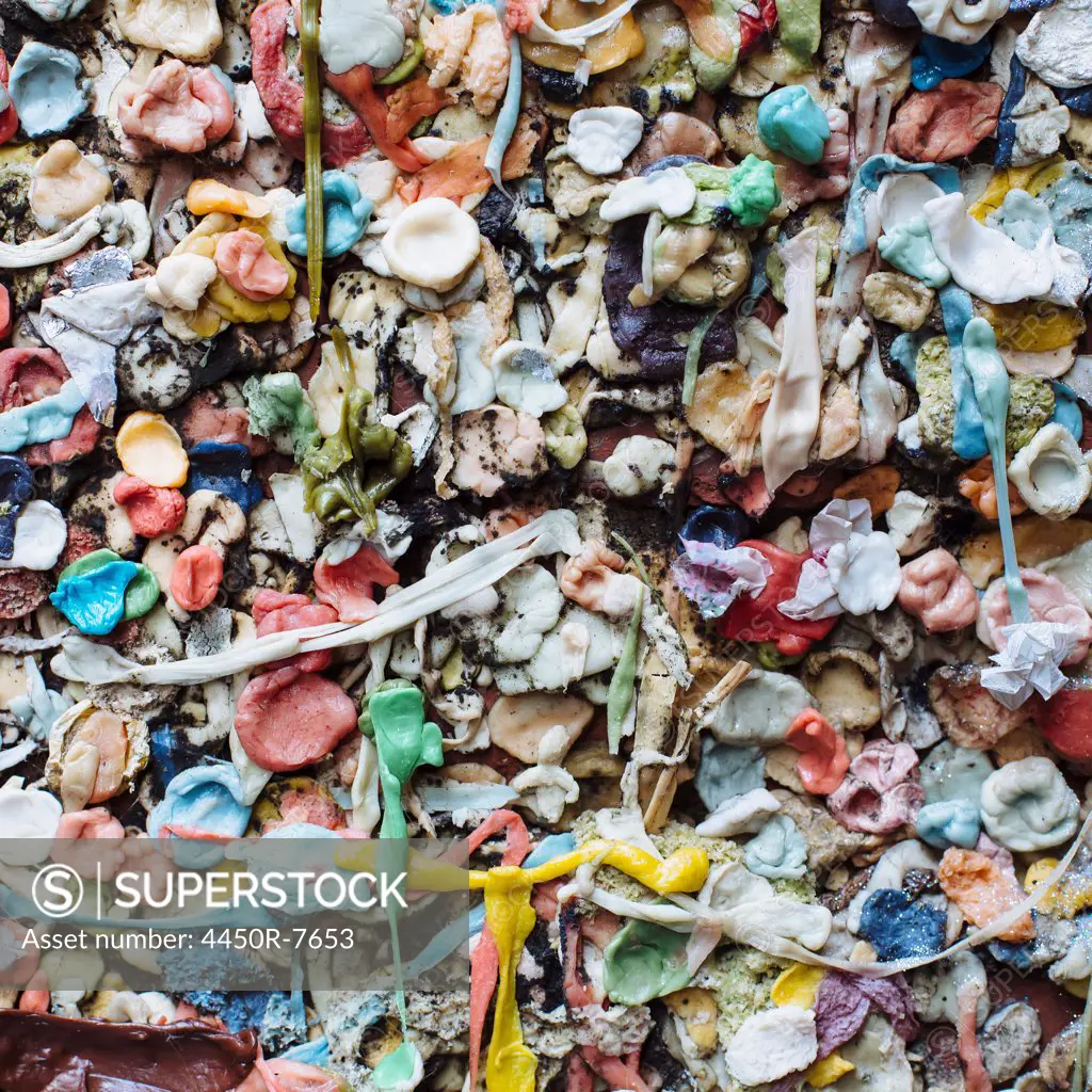 Close up of chewed bubble gum stuck on The Gum Wall in Pike Place market in Seattle.