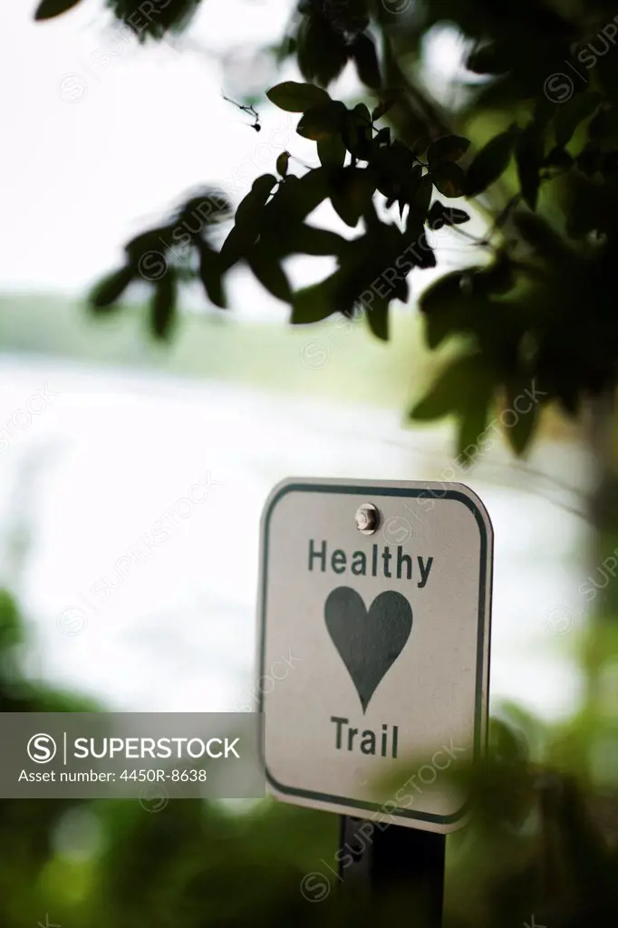 A health trail information sign, a metal marker path sigh with an image of a green heart. Massachusetts, USA. 9/9/2009