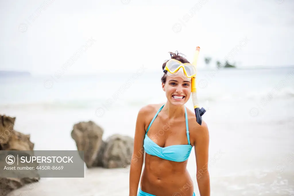 A young woman wearing snorkelling gear on the Samana Peninsula in the Dominican Republic. Samana Peninsula, Dominican Republic. 4/6/2011