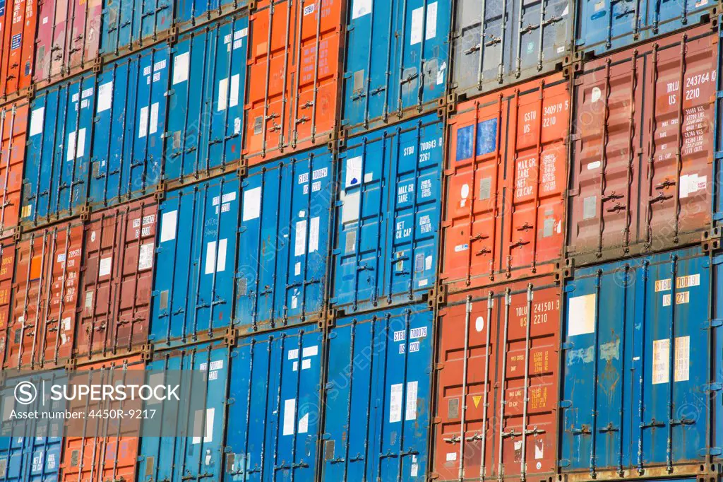 A stack of cargo containers, commercial freight containers, packed together and waiting to be moved. Seattle, Washington, USA. 10/8/2012
