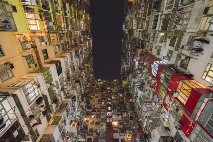 Low angle view of balconies and windows of Monster Building in Quarry Bay.