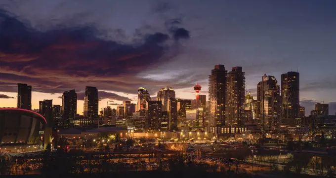 Calgary cityscape lit up at sunset.