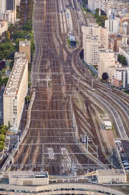 Aerial view of multiple train tracks running into Paris.