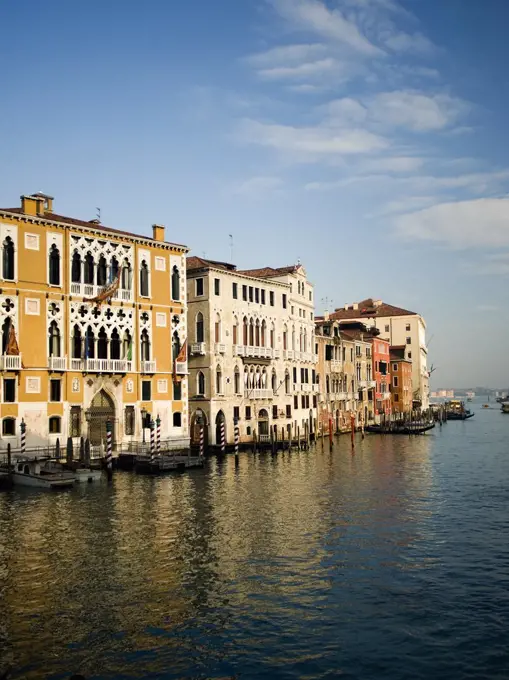 Tall palazzos and historic buildings lining the Grand Canal in Venice.